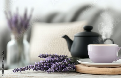 Cozy morning setup with tea, books, and lavender on a wooden table