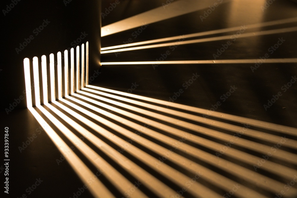 Rays of light are refracted on a black background. Background with a place for text in a stylish and modern concept for advertising phones, perfumes, appliances. Rays of light are refracted on a black background. Background with a place for text in a stylish and modern concept for advertising phones, perfumes, appliances.