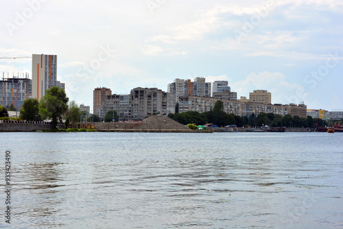 Beautiful nature, bright and colorful weather over the city of Dnipro, Ukraine. Unusual bright real estate, beautiful multi-storey colorful buildings, pleasant architecture, green trees on the embankm photo