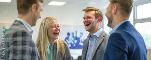 Three coworkers, blonde woman laughing with two men, bright meeting room, grey blazer, blue suit, corporate teamwork.