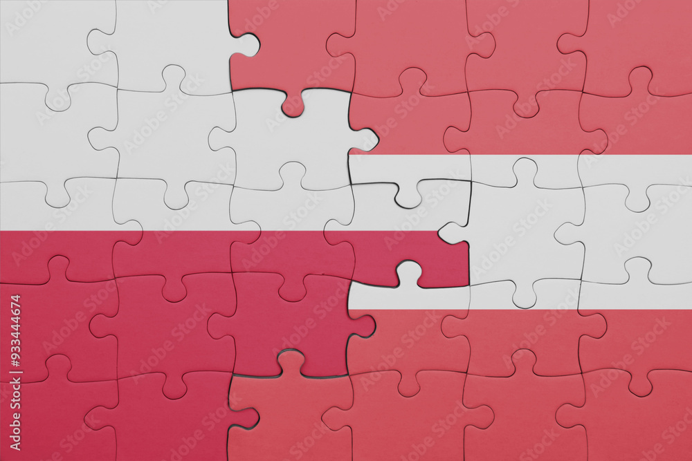 puzzle with the colourful national flag of austria and flag of poland. puzzle with the colourful national flag of austria and flag of poland.