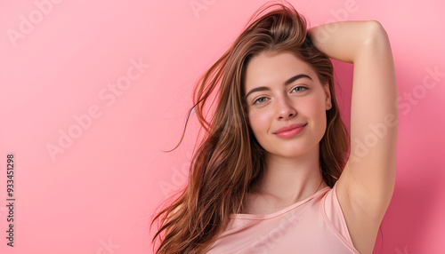 Young woman with healthy hair on color background