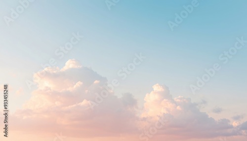 Soft, pink and blue clouds in a light sky.