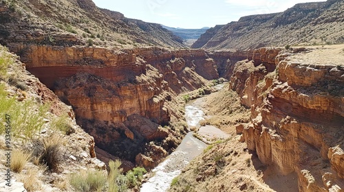 Rugged Desert Canyon with Steep Red Rock Walls and a Narrow River Cutting Through the Arid Landscape. AI generated illustration