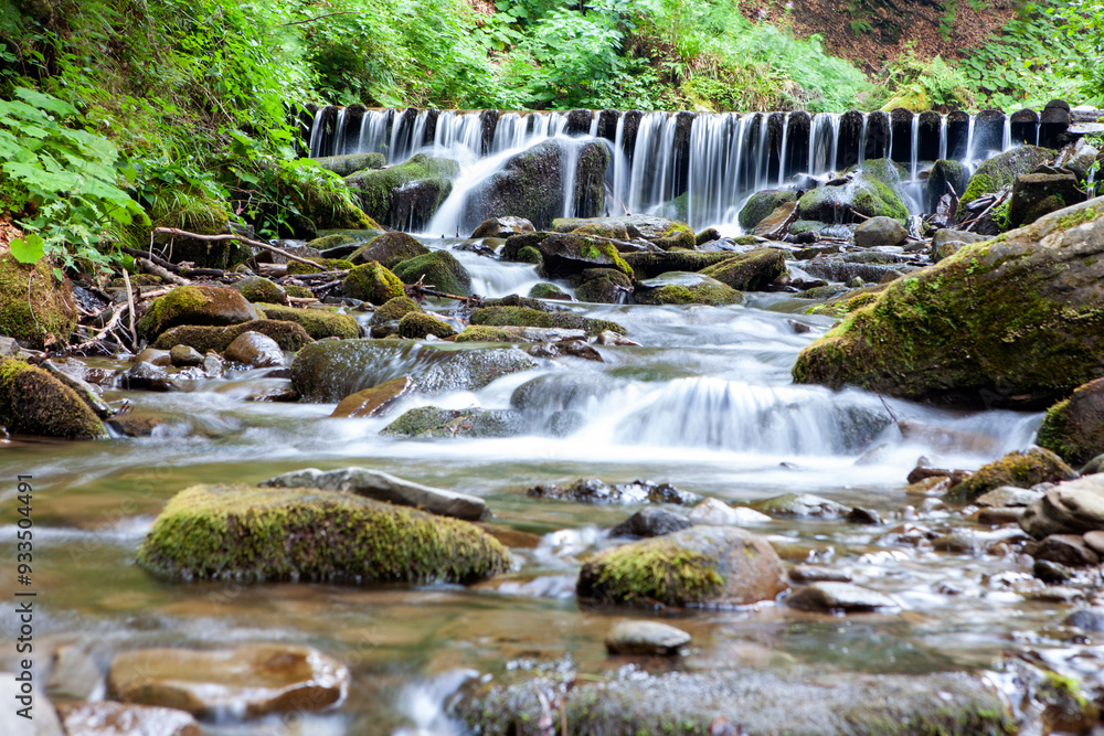 Amazing place in forest with floating waterfall. Wild nature in Ukrainian mountains.Place for text Amazing place in forest with floating waterfall. Wild nature in Ukrainian mountains.Place for text