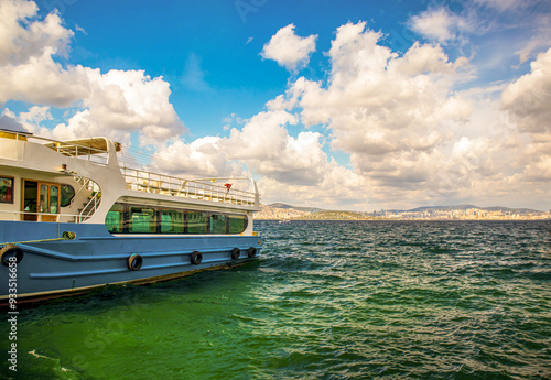 travel ship in the port under wide cloudy sky, prince islands adalar istanbul photo