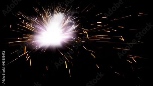 bright sparks of fire while welding on a dark background