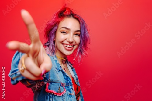 Young woman flaunts vibrant hair style exuding confidence and flair. Fresh and vivid hairstyle brings unique charm to young woman. Intersection of modern fashion and personal expression.