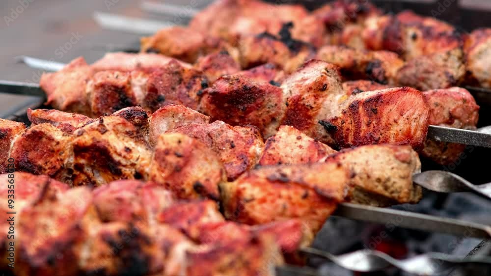 Close-up of delicious grilled kebabs on skewers cooking over a barbecue. Ideal for highlighting outdoor grilling and savory flavors. Close-up of delicious grilled kebabs on skewers cooking over a barbecue. Ideal for highlighting outdoor grilling and savory flavors.