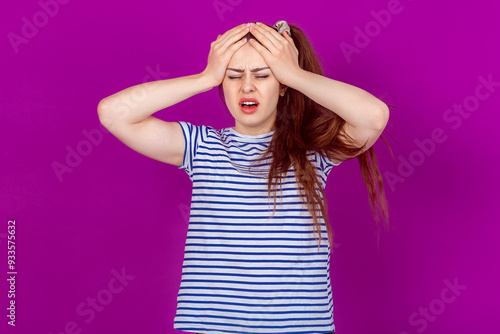 Desperate Young Woman Clutching Her Head Symbolizing Overwhelm and Hopelessness. Photo Depicting Emotional Turmoil and Despair in Response to Life's Challenges and Uncertaintie