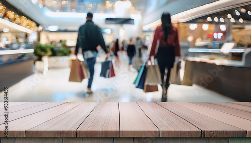 Empty table for product montage. Blurred big sales on Black Friday. bright in the shopping center with shops for shoppers. Sale of clothes in a shopping center. The main background of the design