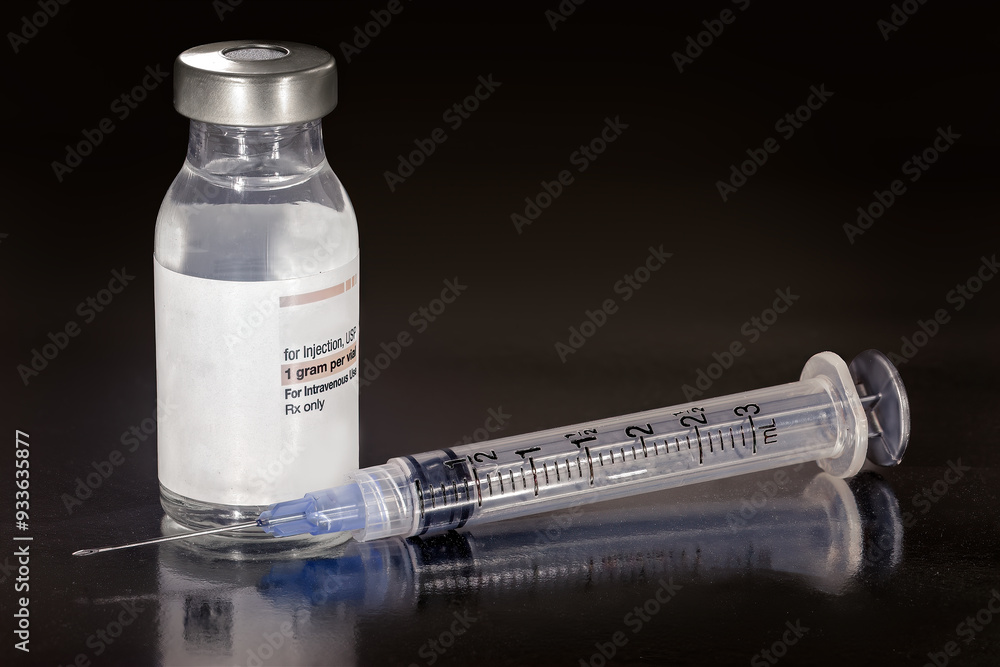 Serum, vaccine in a bottle and an injection needle Serum, vaccine in a bottle and an injection needle