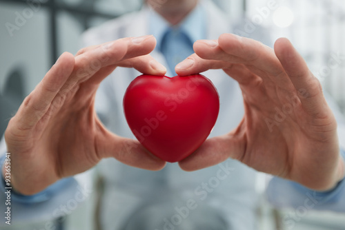 love concept. holding a red heart in hands.