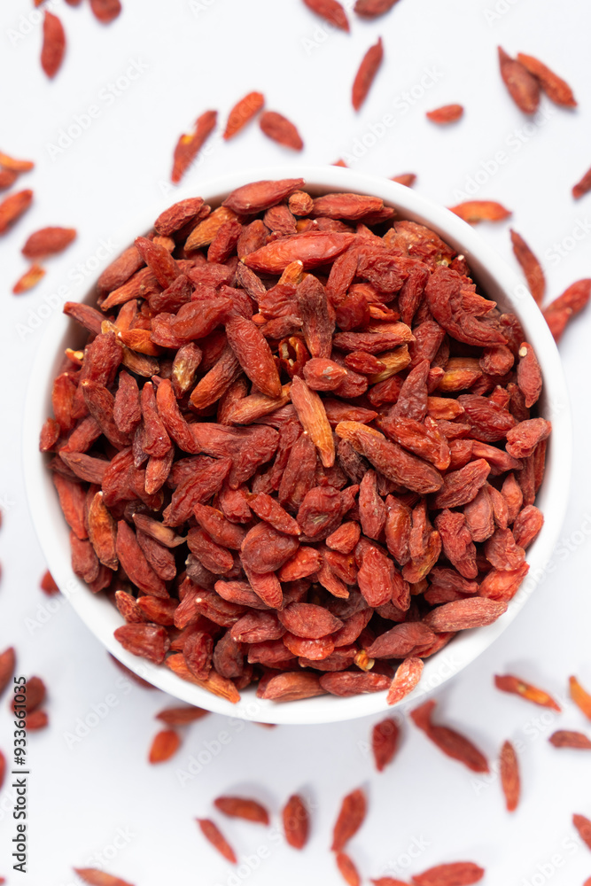 Dried Goji berries Lycium barbarum top view on a white background Dried Goji berries Lycium barbarum top view on a white background