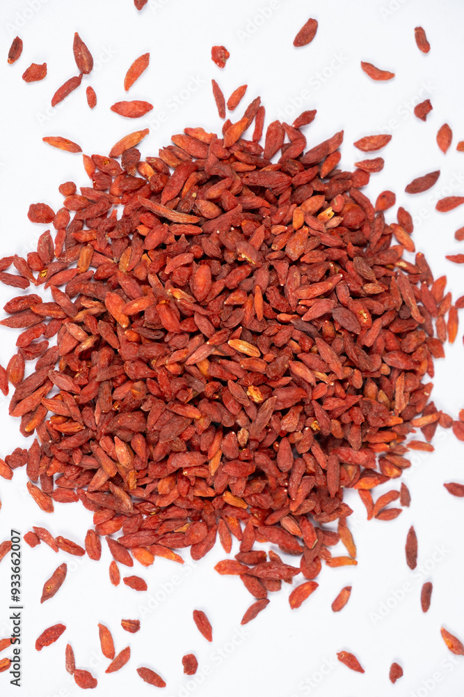 Dried Goji berries Lycium barbarum top view on a white background Dried Goji berries Lycium barbarum top view on a white background