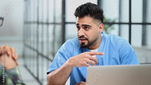 Doctor talking to a patient in a consultation at the office