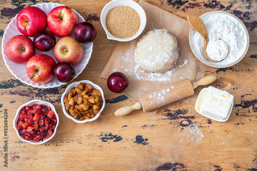 Cooking baking concept. Making rustic American style apple pie, top view on table with ingredients
Cooking baking concept. Making rustic American style apple pie, top view on table with ingredients