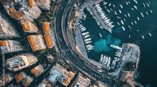 Aerial view of Monaco's Formula 1 Grand Prix circuit, with race cars speeding through the city's streets and along the harbor.