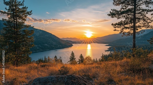 Fototapeta Naklejka Na Ścianę i Meble -  Sunset over Kanas Lake, with the last rays of sunlight casting a warm glow on the water and surrounding landscape.