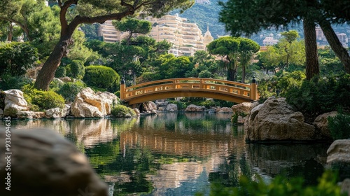 The serene beauty of Monaco's Japanese Garden, with its tranquil pond, traditional bridges, and lush greenery.