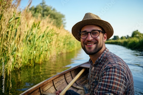 Close-up portrait of adventurer man canoeing or boating on river