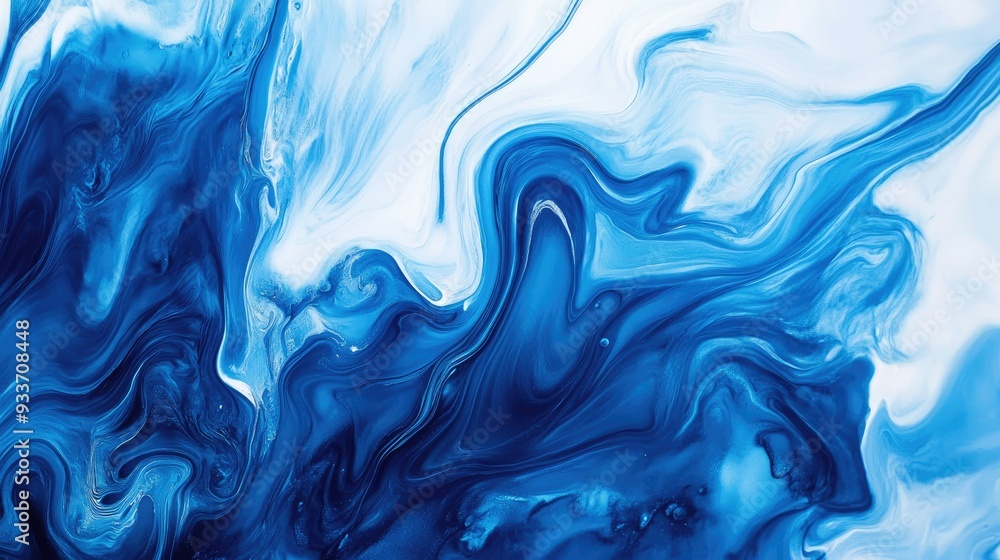 Top-down view of a blue paint swirl on a white background, creating a mesmerizing abstract pattern with shades of blue. Top-down view of a blue paint swirl on a white background, creating a mesmerizing abstract pattern with shades of blue.