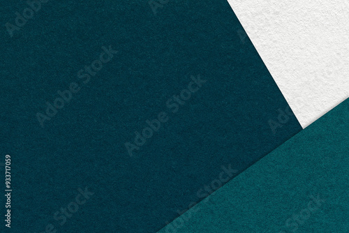 Texture craft dark emerald paper background with white and teal border. Vintage abstract jade cardboard.