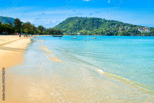 Patong Beach, Thailand, March 2022 . The beach was very quiet due to the Covid 19 pandemic. But the weather was sunny and the beach and sea was very clean and tropical and extremely hot.  photo