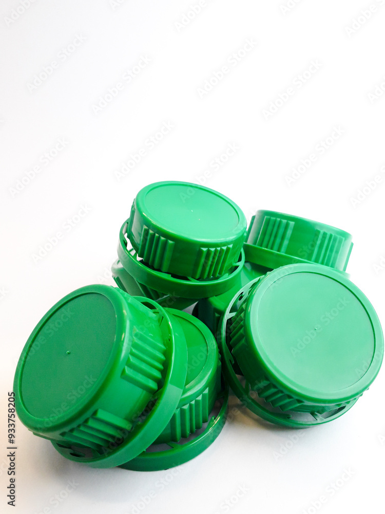 Green plastic bottle cap isolated on white background. Green plastic bottle cap isolated on white background.