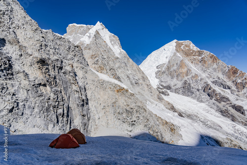 camp on the snowy Chopicalqui glacier in the white mountain range of Peru photo