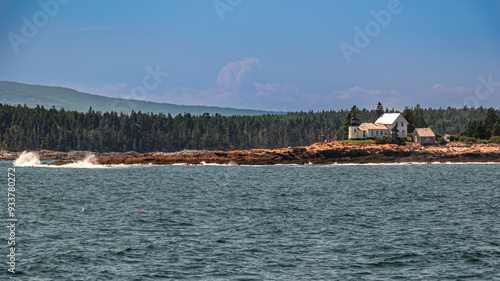 lighthouse on rocky Maine Shore photo