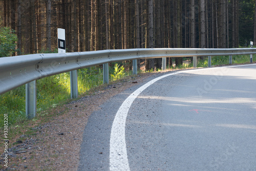 Road with asphalt coating. Heavy and light vehicle movement a road among the mountains. Paved road for car traffic, construction of a new paved road for transport in rural areas