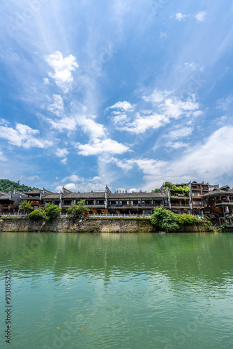 Green Water and Traditional Miao Village Architecture by the River in Fenghuang Ancient Town, Xiangxi, Hunan photo