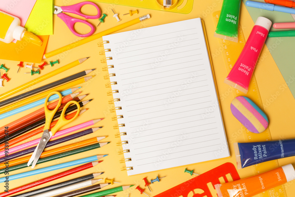 Back to school concept with variety of office and school supplies on yellow background. Back to school concept with variety of office and school supplies on yellow background.