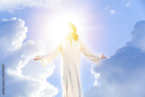 Jesus Christ in sunlight among clouds in sky