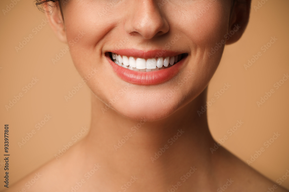 Fototapeta premium Smiling woman on beige background, closeup. Dental veneers