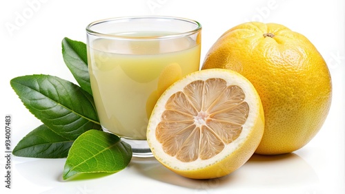 Freshly squeezed pomelo juice fills a glass, garnished with a slice of the vibrant yellow citrus fruit, set against a clean white background. photo