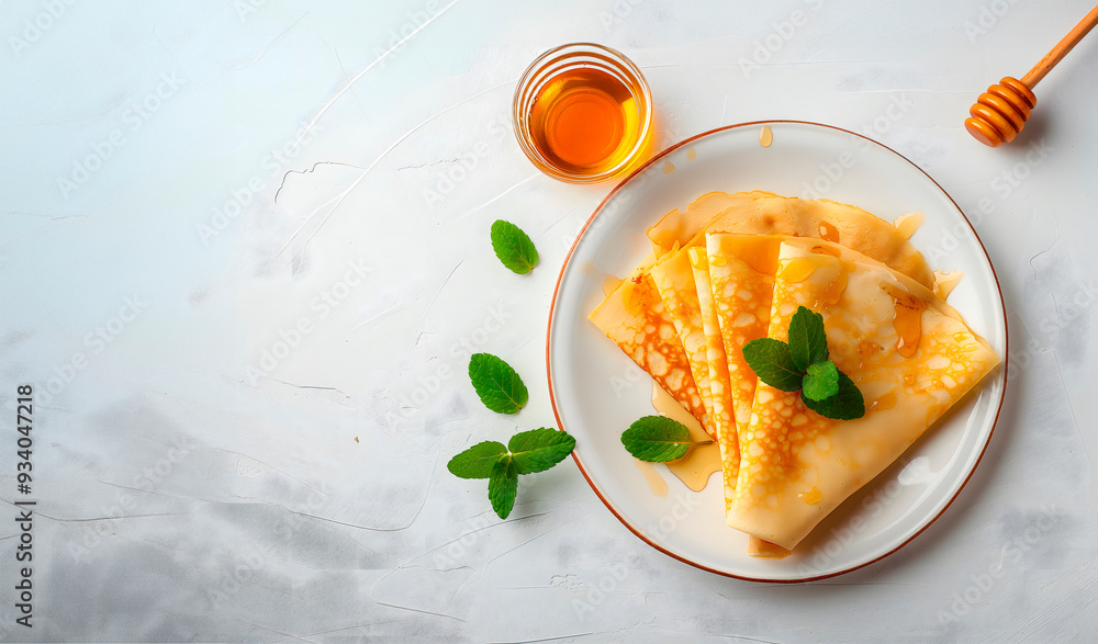 Crepes with honey and mint, ideal for food blog headers, recipe cards, or as a featured image in breakfast-themed culinary magazines and online cooking tutorials,banner with copy space Crepes with honey and mint, ideal for food blog headers, recipe cards, or as a featured image in breakfast-themed culinary magazines and online cooking tutorials,banner with copy space