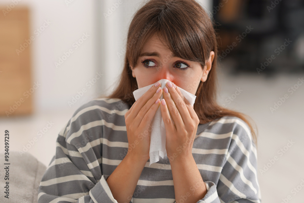 Woman with napkin suffering from sinusitis at home Woman with napkin suffering from sinusitis at home