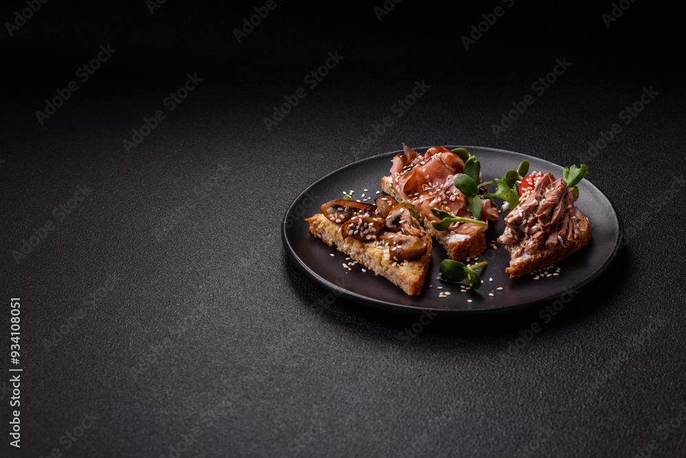 Variation of several toasts or bruschetta with prosciutto, mushrooms and veal Variation of several toasts or bruschetta with prosciutto, mushrooms and veal