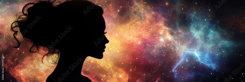 Woman Silhouette Against Cosmic Nebula - A woman's silhouette is set ...