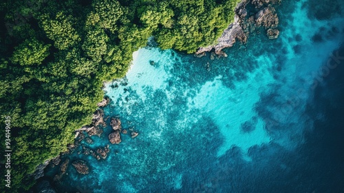 Top view of the tranquil Thai sea with varying shades of blue, no land or boats in sight, just water.