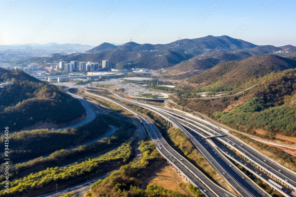 Aerial View of a Complex Highway Interchange in a Mountainous Landscape Aerial View of a Complex Highway Interchange in a Mountainous Landscape