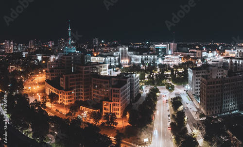 Aerial night illuminated Freedom Square panorama with Derzhprom building view from Klochkivskyj Descent in Kharkiv city, Ukraine photo