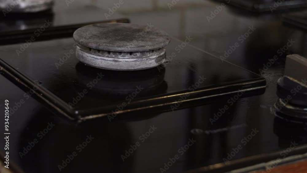 the process of cleaning a black stove in a home kitchen the process of cleaning a black stove in a home kitchen