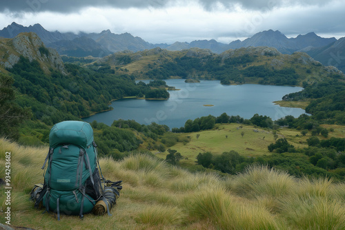 Landscape With Lake And Mountanes And Traveling Backpack In The Bottom Of The Picture photo