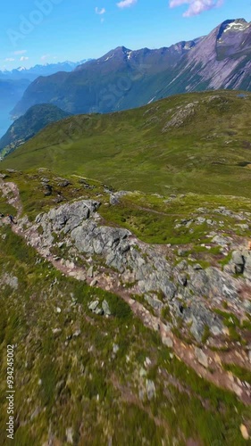 Drone flying like a bird in the Norwegian mountains in summer.