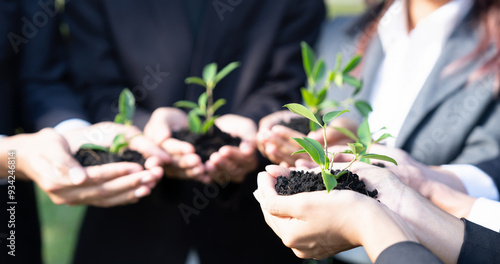 Canvastavla Business people hold plant together in unity and teamwork concept of eco company committed to corporate social responsible, reducing CO2 emission, embrace ESG principle for sustainable future
