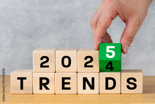Obraz na płótnie Trends 2025 concept of the year. Concept and business plan to optimize 2025 marketing trends in the new year 2025. Find new and information. hand turning green block from 4 to 5, positive symbol w salonie