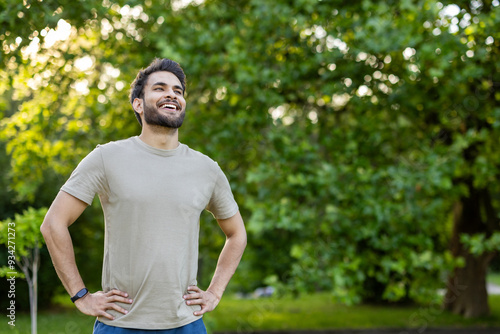 Cuadro en lienzo Joyful man enjoying outdoor fitness in lush park setting wearing casual clothing